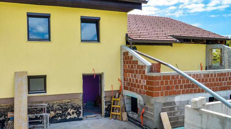 Chantier maison unifamiliale construction d'un agrandissement