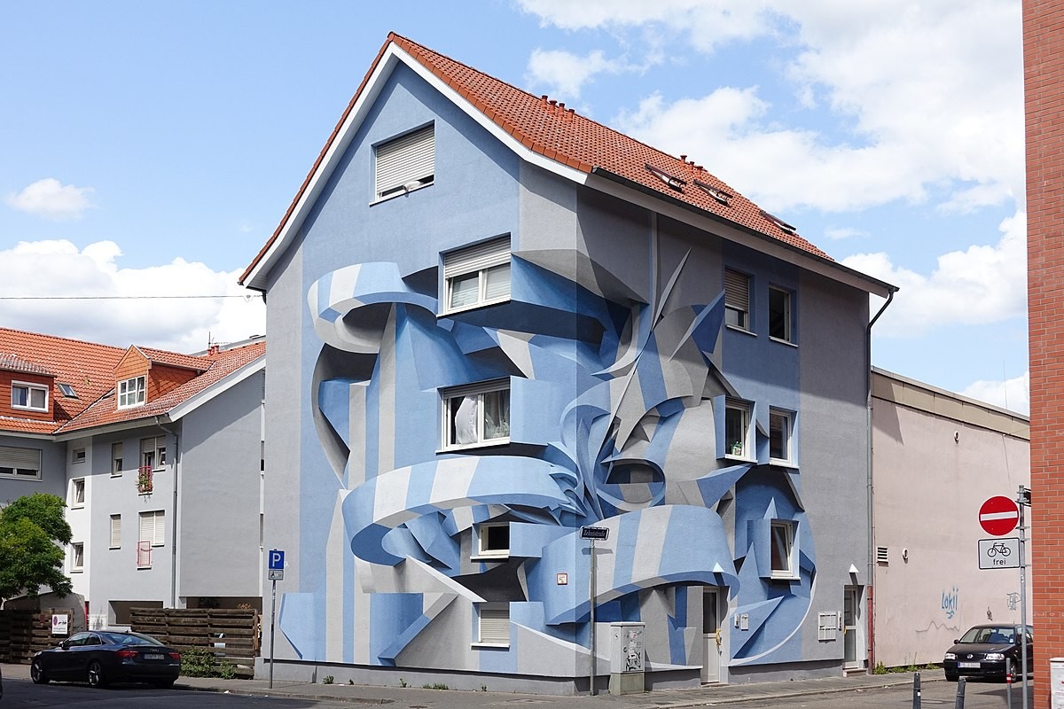 L'artiste graffeur Peeta a réalisé une fresque hallucinante sur un bâtiment de Mannheim, en Allemagne, dans le cadre du projet représentant les artistes de rue, le  Stadt Wand Kunst 2019.