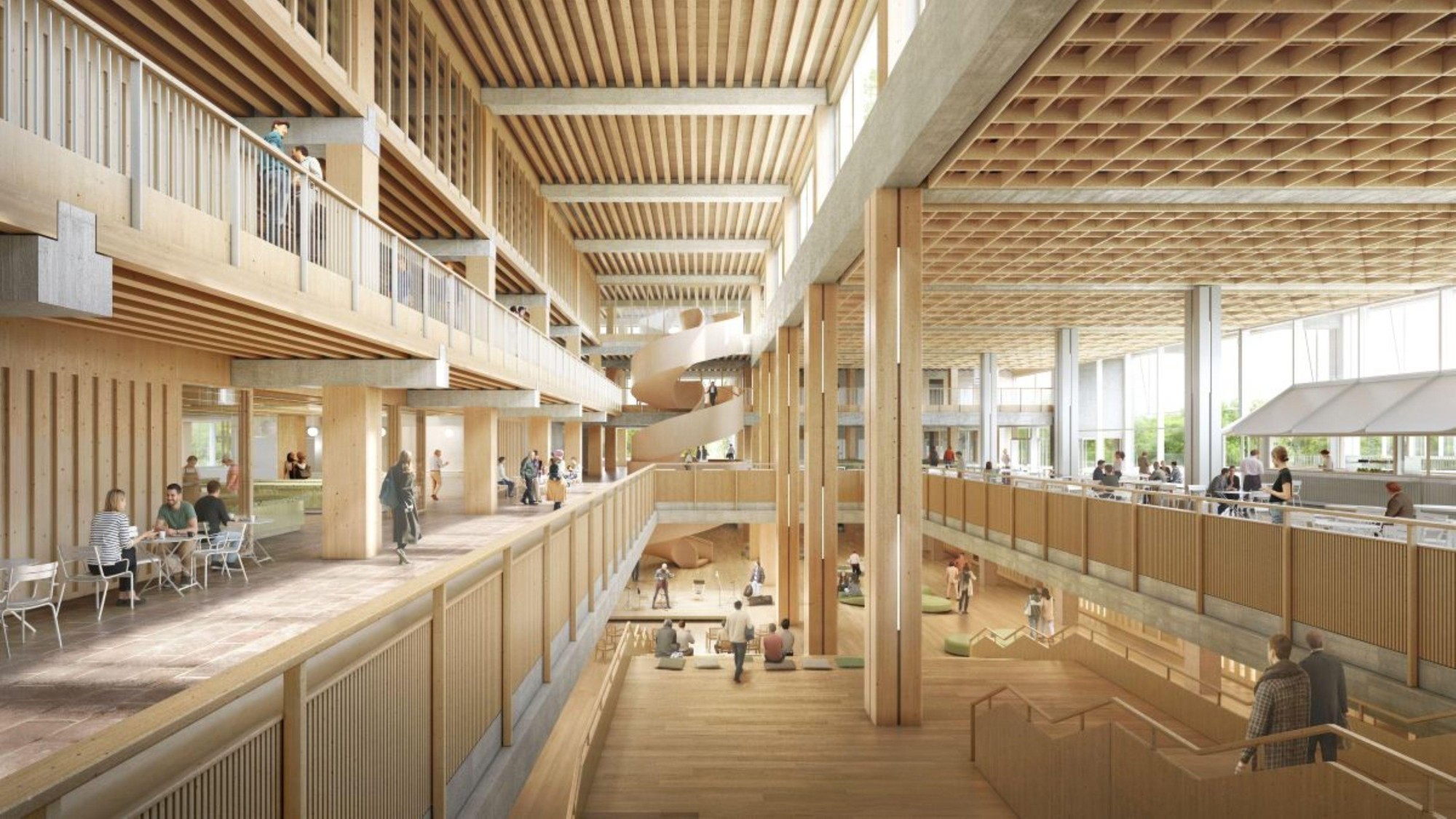 Une vue de l’intérieur du bâtiment principal montre l’atrium, qui relie le foyer aux amphithéâtres, aux salles de séminaire ainsi qu’aux espaces d’enseignement et de travail destinés aux étudiants et au personnel.
