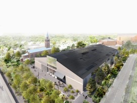 Sous le toit à deux pans équipé de cellules photovoltaïques se cachent de multiples espaces. A droite, en arrière-plan se trouve la Philharmonie de Hans von Scharoun.